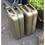 Two large green painted metal jerry cans - late 20th Century