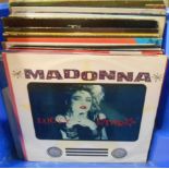 A box of LPs and 12" singles including Madonna, Terrence Trent Darby, etc.