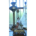 A brass table oil lamp and Italian Capodimonte figure lamp on gilt brass base