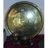 A quantity of eastern brassware including trays, bowls, etc.