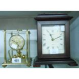 A vintage Kein brass and glass oblong cased anniversary clock with ball pendulum - internal chip