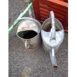 Two old watering cans