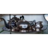 A silver plated three piece tea set, another teapot and an oval tea tray