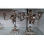 A pair of 20th Century silver plated four branch, five light candelabra