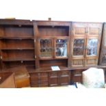 An Old Charm multi section linen fold oak and leaded glazed effect wall unit with various