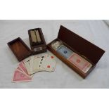 Two wooden playing card boxes containing two decks, die, etc.