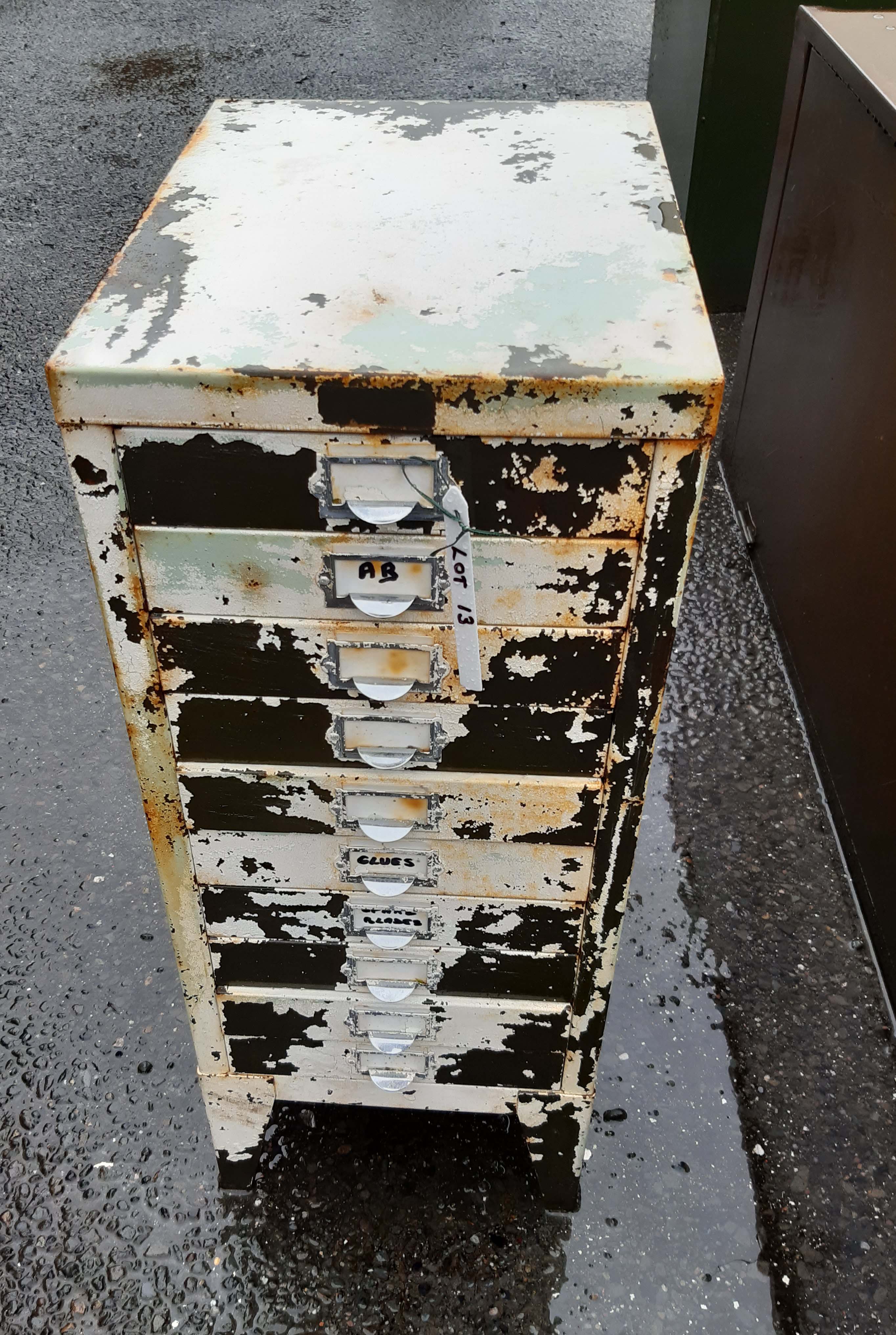 A vintage ten drawer filing cabinet with contents