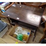 A 71cm early 20th Century stained oak side table with trough undertier, set on shaped and pierced