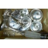 A box of silver plate including tea set, muffin dish, candlesticks, etc.