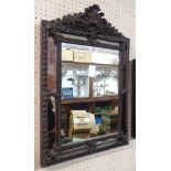 A reproduction ornate cast resin framed wall mirror in the antique style with mirrored border