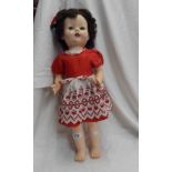 A vintage English doll with original clothing