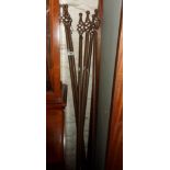 Six wrought metal curtain rails - with rings