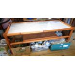 A 1.21m 1970's G-plan stained wood coffee table with glass inset top and simulated bamboo