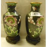 A pair of 20th Century cloisonne vases on wooden stands
