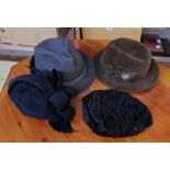 A bag containing four vintage hats