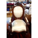 A reproduction Victorian style miniature panel back elbow chair with acanthus scroll decoration