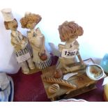 Two Laura Dunn pottery figures of bakers - various condition