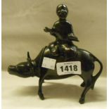 An eastern lacquered copper incense burner in the form of a man riding an ox - man a/f