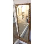 A 20th Century gilt framed narrow oblong wall mirror - small area of border loss