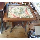 A 62cm Art Nouveau stained hardwood centre table with original floral needlework under glass to top,