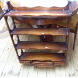 A 69cm Bevan Funnell Reprodux mahogany wall mounted four shelf unit with pierced sides and three