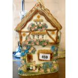 A hand made pottery night light in the form of a Bavarian cottage