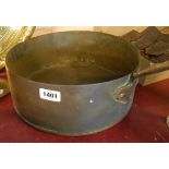 A large copper sauce pan with iron handle