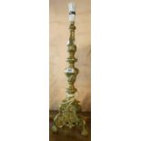 A large brass candlestick form table lamp