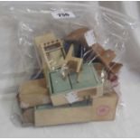 A quantity of vintage wooden dolls house furniture