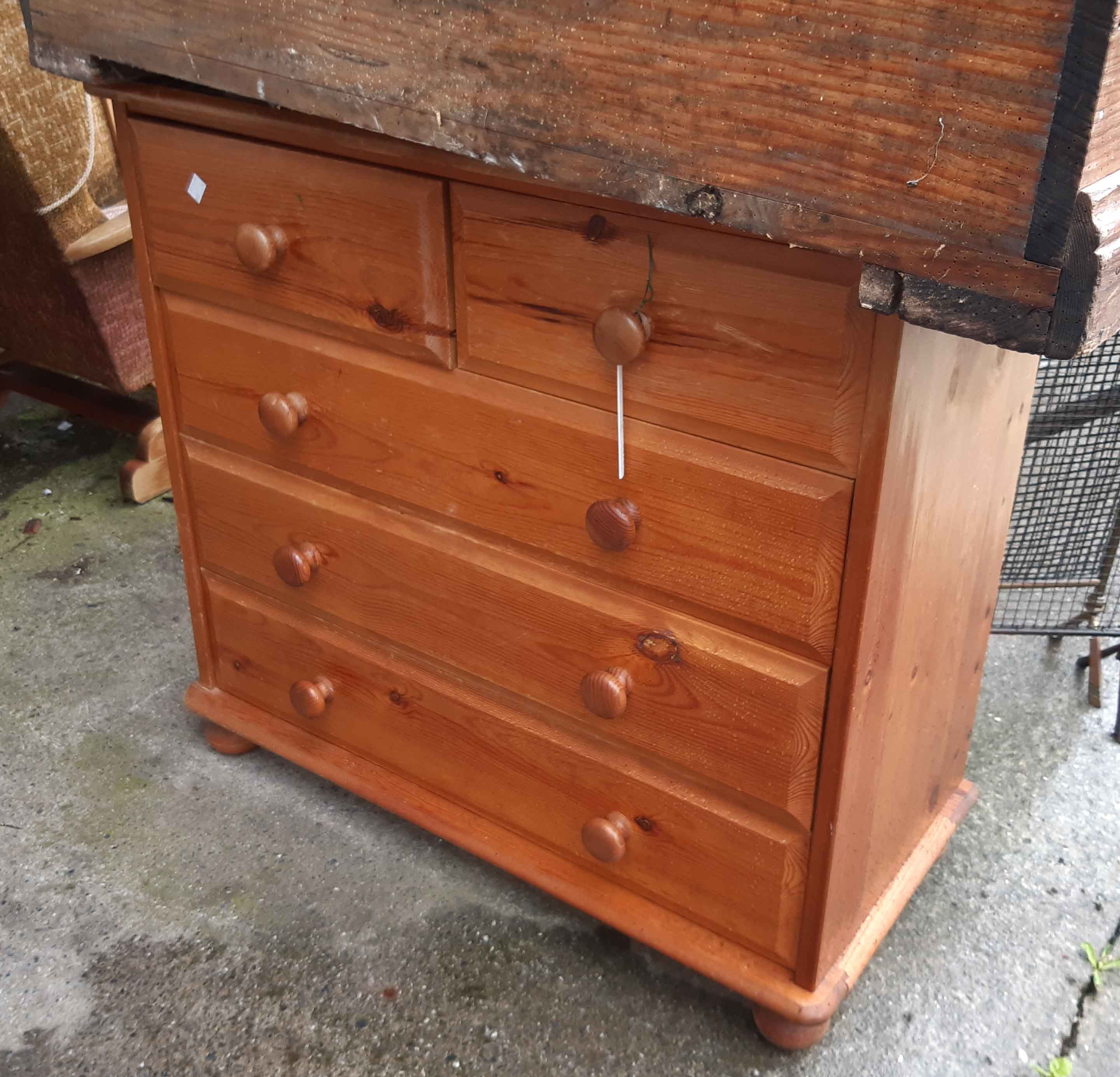 A modern pine chest of two short and three long drawers - wear