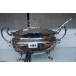 A silver plated soup tureen and associated ladle