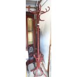 A modern freestanding stained bentwood hat and coat stand