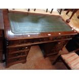 A 1.22m 20th Century reproduction mahogany twin pedestal desk with green leather inset top, three