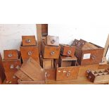 A 1.23m vintage mixed wood apothecary's chest with an array of varying sized drawers, some