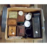 A box containing assorted collectable items including advertising and other tins, wooden cigarette