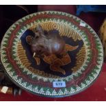 An ethnic ceramic bowl decorated with turtle motif - sold with carved wooden elephant and rider