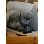 A box containing five pieces of antique Chinese porcelain, including vases and mugs