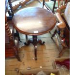 A 50cm diameter 19th Century mahogany tilt-top pedestal table, set on turned pillar and tripod base