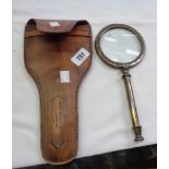 A reproduction large brass magnifier in leather holster style case