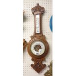An early 20th Century oak cased banjo barometer/thermometer with visible aneroid works - thermometer