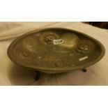 An Art Nouveau pewter footed bowl by Roundhead Pewter, decorated with entwining floral motifs and