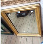 A 77cm X 63cm antique gilt framed bevelled oblong wall mirror