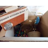 A box containing assorted kitchenalia items including glass and ceramic jelly moulds, vintage