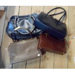 A bag containing four vintage handbags