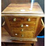 A 51cm far eastern polished hardwood side cabinet with three drawers, cupboard under and flanking