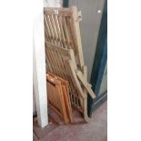A reproduction slatted wood steamer deckchair - sold with a pair of modern folding chairs