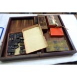 A folding wooden chess and backgammon board - sold with assorted games