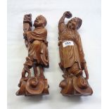 A pair of late 19th Century Chinese carved hardwood figures