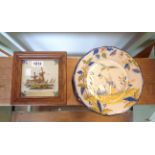 A 20th Century framed Dutch Delft tile and a faience plate