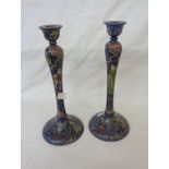 A pair of old Persian lacquered Qajar candlesticks